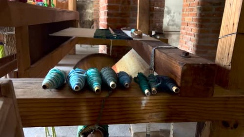 Colored Wool Threads Yarns on Wooden Counter Inside Rugs Workshop, Artisan Fabric Handicraft Manufac