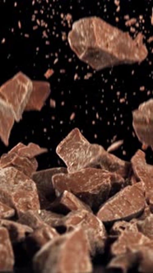Pieces of Chocolate Fall on the Table Filmed on a Highspeed Camera at 1000 Fps