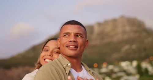 Couple Embracing on a Beach at Sunset