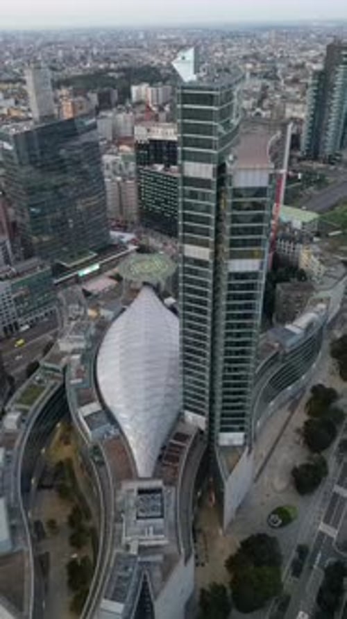 Aerial video above the skyscrapers of Milan city