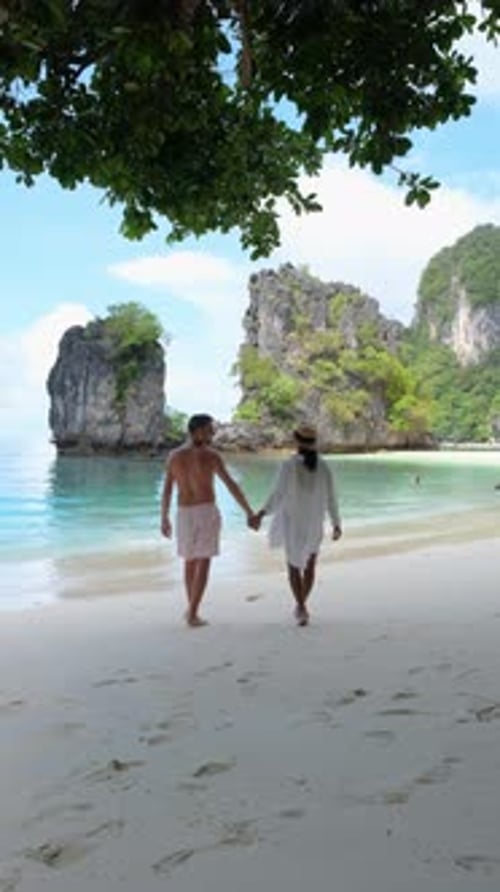 A Couple Strolls on the Beach Holding Hands and Admiring Natures Beauty Koh Hong Krabi Thailand