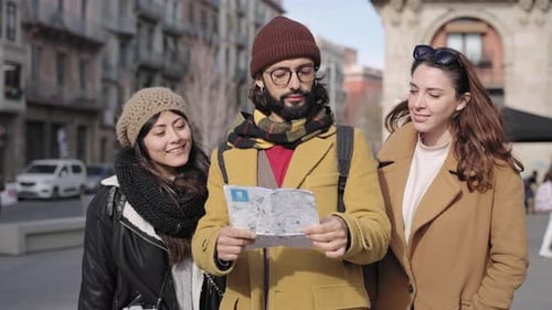 Group of Friends Looking at a Map in City