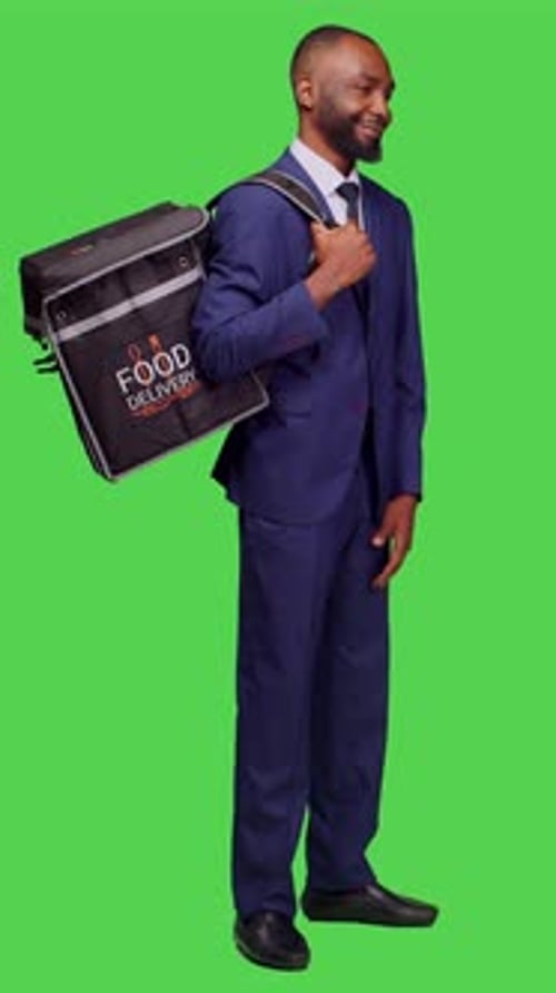 Vertical Video Side View of Young Deliveryman in Suit Giving Fast Food Order