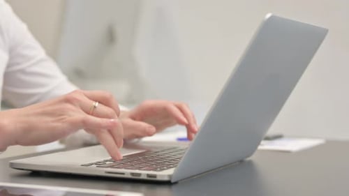 Close up of Woman Typing on Laptop