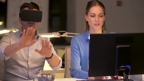 Virtual reality business team overworking late at night in a modern office