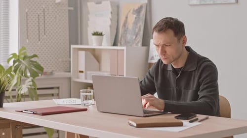 Businessman Working with Documents in Office