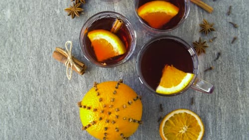 Christmas and Seasonal Drinks Concept - Glasses of Hot Mulled Wine With