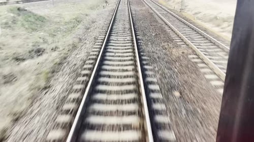 View on Railroad Track From the Back Window of Fast Train Bullet Train Rides on the Railway Track