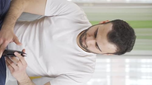 Man Counts Money From Wallet Indoors Daytime