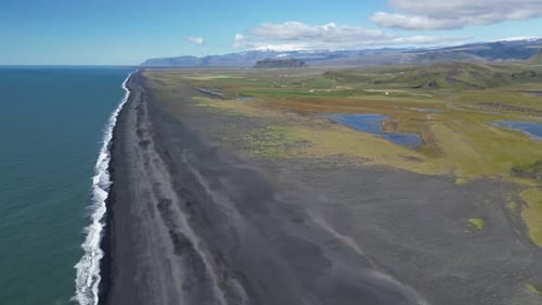 Aerial View of Dyrholaey Beach in Iceland with Black Sand Shores