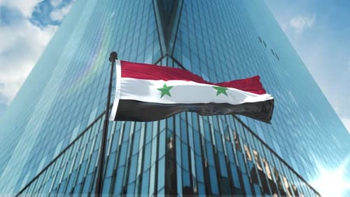 Waving Syrian Flag in Front of Modern Corporate Building