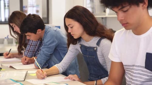 Group Of Guys And Girls Doing Class Assignment In The Library. Young University Students Reading ...