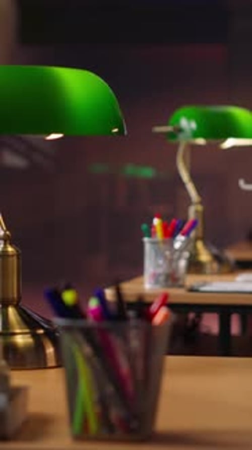 Vertical Video Peaceful Empty Library Featuring Wooden Shelves and Vintage Green Lamps