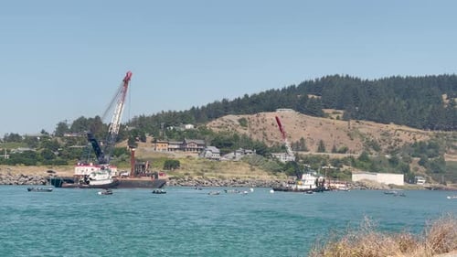 Dredging ships on the Rogue River in Gold Beach, Oregon.