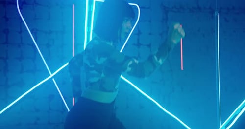 Concentrated Sporty Woman Runs in Place Moving Arms Actively