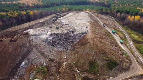 Trash From Household Waste Garbage Trucks Carry Garbage to a Landfill Top View