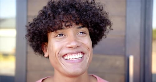 Young Adult Smiling Outdoors