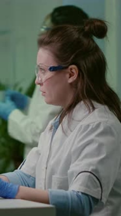 Female Scientist Working in Modern Medical Laboratory
