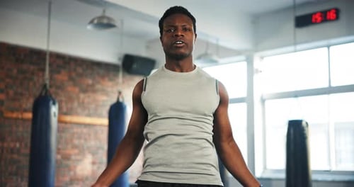 Black man, fitness and skipping rope in cardio workout, exercise or training at indoor gym