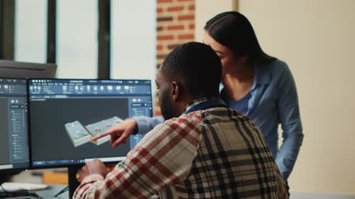 Colleagues Collaborating on Design Project in Office