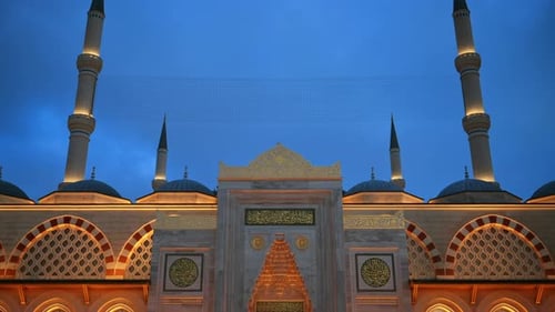 View of the Camlica Mosque in Istanbul at evening, Turkey. Facade made of white stone, illumination