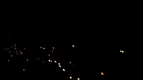 Animated Golden Sparkles on Black Background