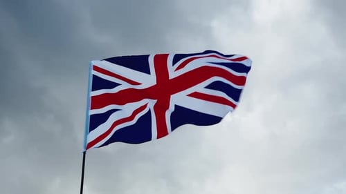 British Flag Waving Against Overcast Sky