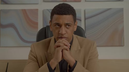Portrait of Thoughtful African American Businessman with Pensive Expression