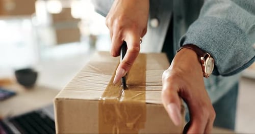 Business woman, hands and cutting box with delivery in logistics, supply chain or package at office