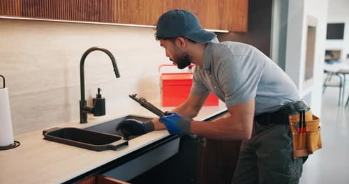 Check, faucet and man in kitchen, plumbing and fixing sink with tools and water inspection in house