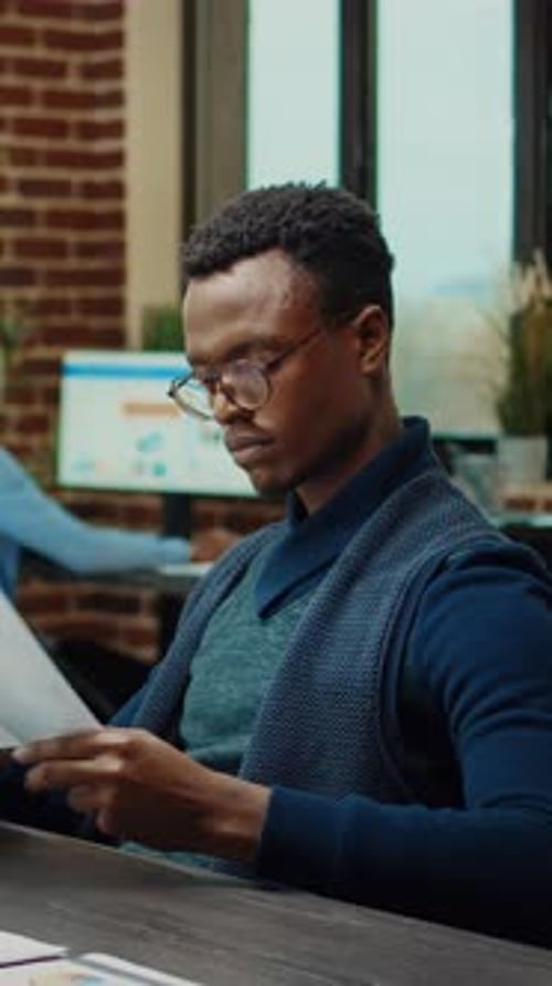 Vertical Video Office Workers Checking Documents
