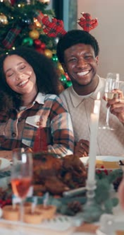 Happy Couple Celebrating Christmas at Home with Meal