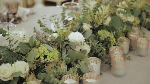 Wedding Table Decorated with Flowers and Candles