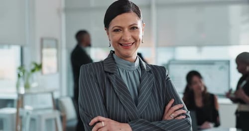 Smiling Businesswoman Confidently Poses in Modern Office