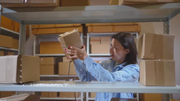 a Damaged Parcel in the Warehouse is Not Satisfied with the Employee ...