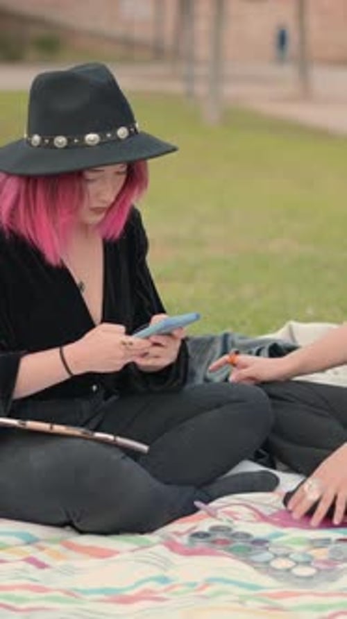 Attractive White Girls Sitting on Sheet on the Grass in the Park Human Interaction Friendship