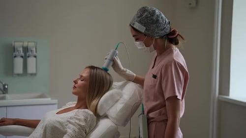 Woman Receives Medical Treatment from Doctor in Clinic