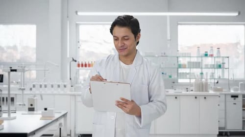 Scientist Writing on Clipboard in Bright Laboratory
