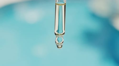 Close up of Pipette Dropping Liquid