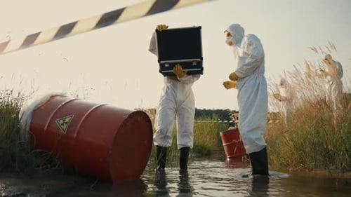 People in Hazmat Suits Analyzing Contaminated Area