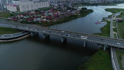 Cars Navigate Lanes of City Bridge During Rush Hour