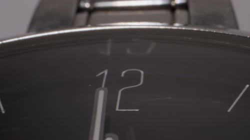seconds hand moving in hand watch closeup view