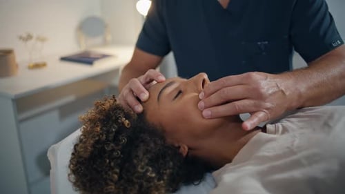 Woman Lying Chiropractic Therapy in Health Center Closeup Man Doctor Massaging