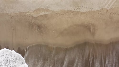Foam on the Beach During the Storm Ocean Vertical