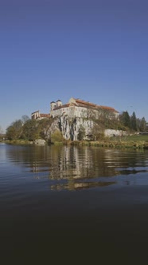 Vertical Aerial Drone View of Tyniec Abbey with Vistula Reflections