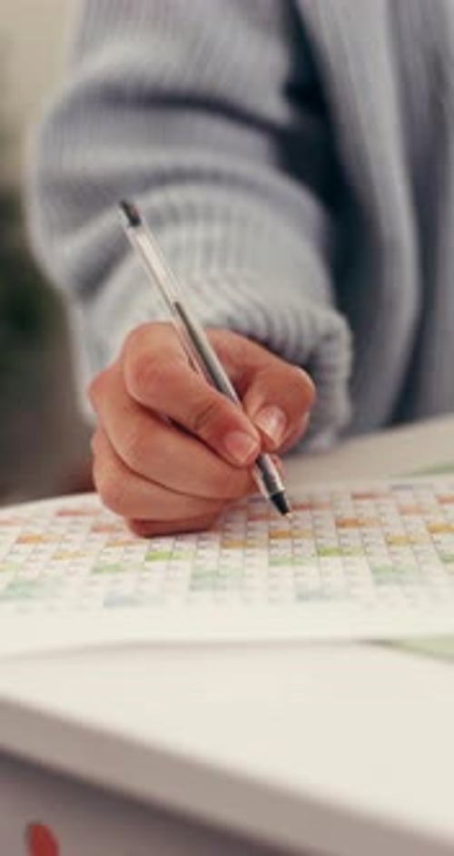 Hand, writing and calendar for planning agenda, timetable or remote work task