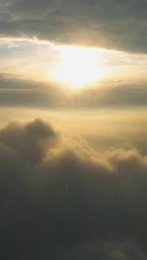 Majestic Clouds Bathed in Golden Sunrise Light