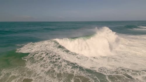 Giant Breaking Waves On A Sunny Day In Nazare, Portugal. - aerial