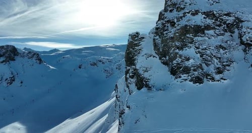 Aerial View of Snowy Mountains in Winter