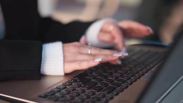 CloseUp of Hands Typing on Laptop with Rings and Polished Nails ...